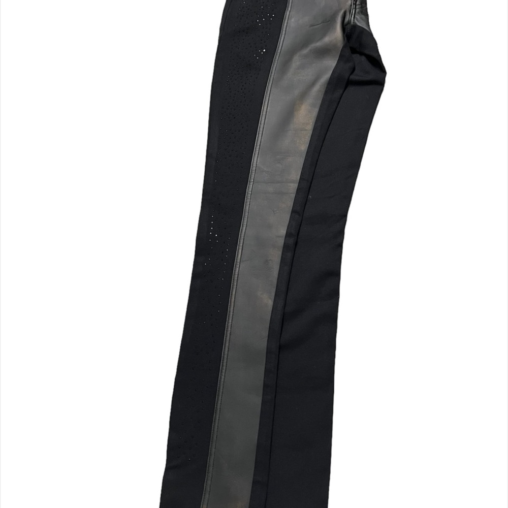 Black jeans with vegan leather patchwork and rinestones